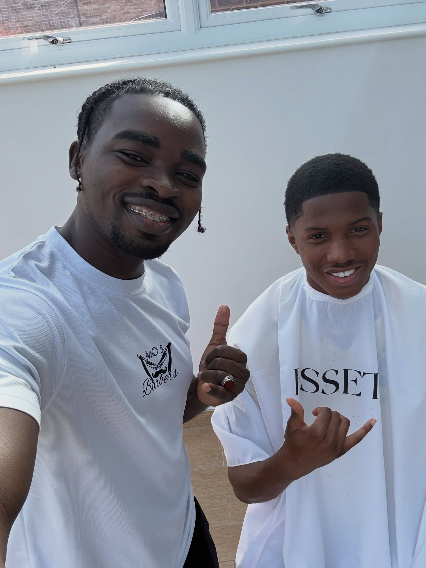 Mo with Chido Obi after cutting his hair in Spain
