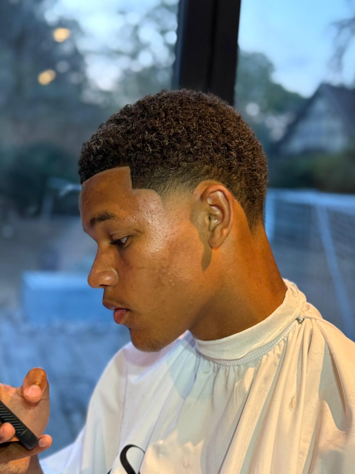Curly fade side profile