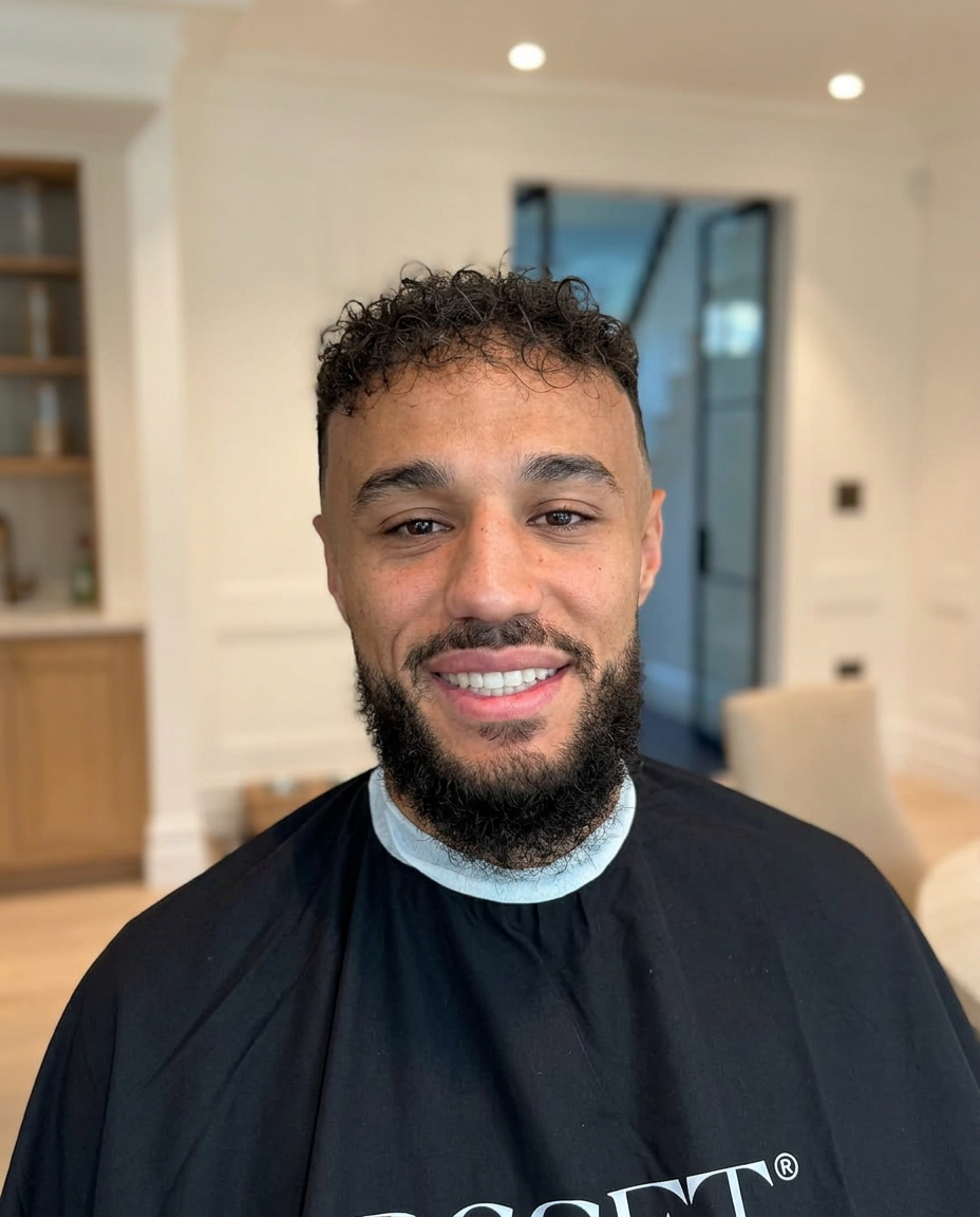 Close-up of a curly top fade