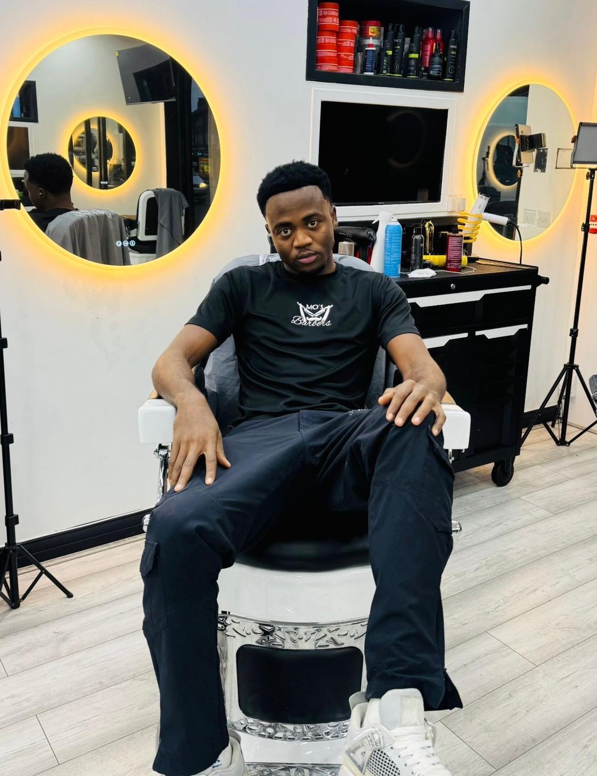 Abdu, Barber at Mo's Barbers