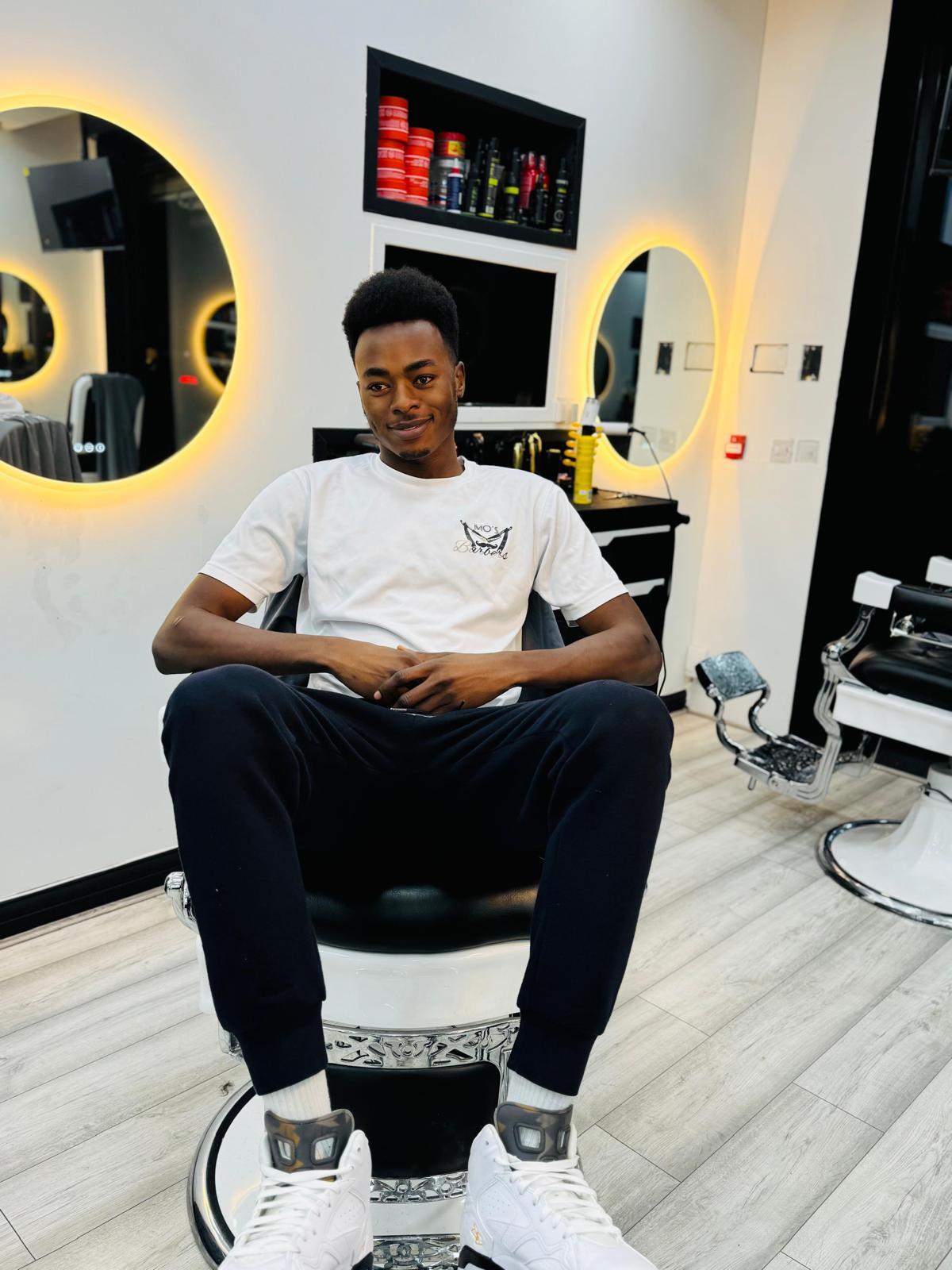 Lil Mo, Barber at Mo's Barbers