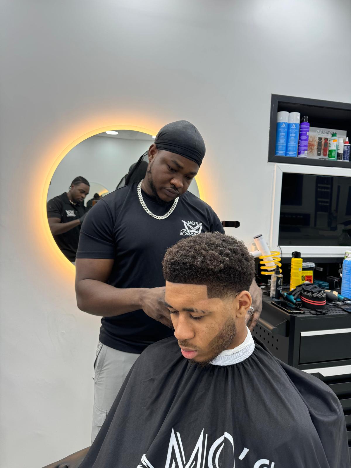 Muawiya, Barber at Mo's Barbers